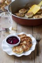 Traditional Russian syrniki with raisins. Sweet quark pancakes with blueberry