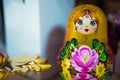A traditional Russian toy, a bright babushka dolls, stacking dolls, nesting dolls with a beautiful face, in gold