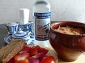 Traditional Russian vodka `Stolichnaya`. As a snack, fresh tomatoes, radishes, rye bread, an earthen pot with meat and potatoes.