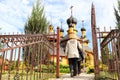 Traditional russian wooden church with domes in nature landscape. Architecture in the Orthodox religion Royalty Free Stock Photo