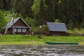 Traditional russian village house on the river bank Royalty Free Stock Photo