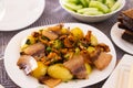 Traditional rustic dish. fried potatoes with chanterelle mushrooms and pork brisket with herbs Royalty Free Stock Photo