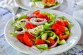 Traditional rustic Greek salad on white plate Royalty Free Stock Photo