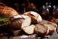 Traditional rustic table setting with freshly baked white bread and sheaves of wheat