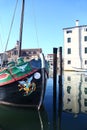 Traditional sailboat & canal in Chioggia, Italy