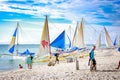 Traditional Sailboats on Crowded Boracay white beach
