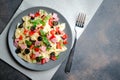 Traditional salad with pasta farfalle, ham, pepper and herbs Royalty Free Stock Photo