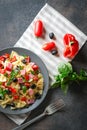 Traditional salad with pasta farfalle, ham, pepper and herbs Royalty Free Stock Photo