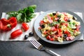 Traditional salad with pasta farfalle, ham, pepper and herbs Royalty Free Stock Photo