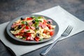 Traditional salad with pasta farfalle, ham, pepper and herbs Royalty Free Stock Photo