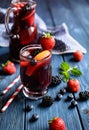 Traditional Sangria drink with red wine, tropical fruit and berries