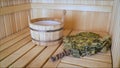 Traditional sauna stuff - birch whisk and a bucket. Wooden bucket and whisk in the sauna