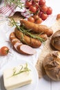 Traditional sausage, country pork sausage with tomatoes and bread