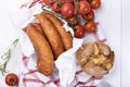 Traditional sausage, country pork sausage with tomatoes and bread