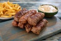 Traditional sausages mici on chopping board