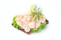 Traditional savory swedish sandwich with a dark bread, lettuce, eggs, mayonnaise, shrimps, dill and lemon, isolated on a white