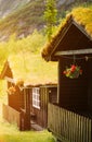 Traditional scandinavian Old Wooden guest Houses With Growing Grass On Roof. Cabins In Norway. sunny sunshine good Royalty Free Stock Photo