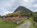 Traditional Scandinavian wooden cabins sod or turf roof house at a campsite in the Reinheim national Park. View from scenic road