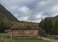 Traditional Scandinavian wooden cabins sod or turf roof house at a campsite in the Reinheim national Park. View from