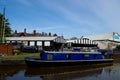 Traditional scene with a blue barge on the Bridgewater canal in Worsley, Manchester, United Kingdom