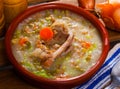 Scotch broth with barley, lamb, vegetables, peas in clay bowl Royalty Free Stock Photo