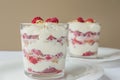 Traditional Scottish dessert. Cranachan with raspberry, whipped cream, whisky and roasted oatmeal close-up