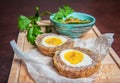 Traditional Scottish meat cutlet with boiled eggs, cucumber and fresh parsley