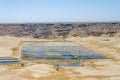 Traditional sea salt farming in square pools at Angola`s coast