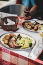 Traditional portuguese grilled octopus, boiled potato and cabbage in cafe Royalty Free Stock Photo