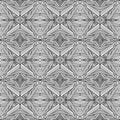 Traditional seamless pattern drawn with abstract rhombuses and stars on a white background