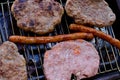 Traditional serbian barbecue rostilj  homemade sausages and burgers. Preparing a barbecue on a grill, outdoor roasting meat. Tra Royalty Free Stock Photo