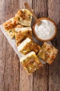 Traditional Serbian Gibanica with cheese, eggs and greens close-up and yogurt. Vertical top view Royalty Free Stock Photo