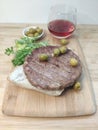 Traditional Serbian Pljeskavica dish made of spiced meat patty mixture of pork, beef and lamb