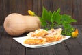 Traditional Serbian pumpkin strudel served on white plate.