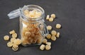 Traditional shape of dry uncooked whole wheat Italian pasta in glass jar Royalty Free Stock Photo