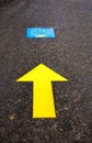 Traditional shell sign and yellow arrow painted on the way. Direction sign for pilgrims in Saint James way, Camino de Santiago de Royalty Free Stock Photo