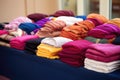 traditional sikh turbans and scarfs neatly arranged in a gurdwara