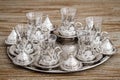 Traditional Silver Coffee Cup Set in a Tray on Wooden Background