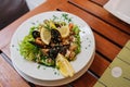 Traditional slovenian cuisine, seafood salad with fresh mussels, selective focus Royalty Free Stock Photo