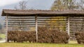 A traditional Slovenian drying frame hay rack called a kozolec in the countryside near Lake Bled, Slovenia, in the autumn season Royalty Free Stock Photo