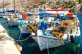 Traditional small fishing boats docked in main port of Symi island in Greece Royalty Free Stock Photo