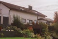 Traditional Small House With Beautiful Outdoor Decor Facade In Germany. German Old Brick Building House Ancient European