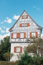 Traditional small house with beautiful outdoor decor facade in Germany. German old brick building house ancient European