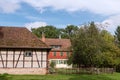 Traditional Small House With Beautiful Outdoor Decor Facade In Germany. German Old Brick Building House Ancient European