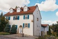 Traditional small house with beautiful outdoor decor facade in Germany. German old brick building house ancient European