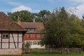 Traditional Small House With Beautiful Outdoor Decor Facade In Germany. German Old Brick Building House Ancient European