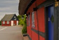 a traditional small,red,danish framehouse in summer in Bornholm with blue sky Royalty Free Stock Photo