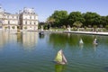 Traditional small wooden sailing boat in the pond of park Jardin du Luxembourg, Paris, France