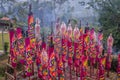 Traditional smoke candles burning for Chinese New Year behind temple