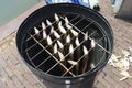 Traditional smoked eels fish in a smoking in metal barrel Royalty Free Stock Photo
